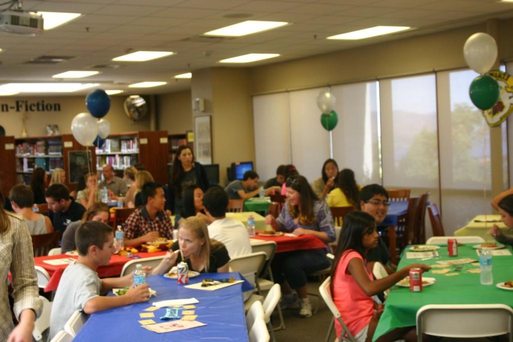 Students and teachers enjoying lunch in the library.
