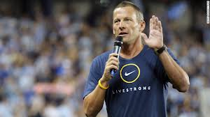 Armstrong is shown here, with a shirt recognizing Livestrong.