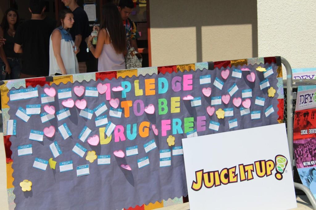 Students filled out stickers with their names on it and stuck them to a poster, pledging to be drug free.