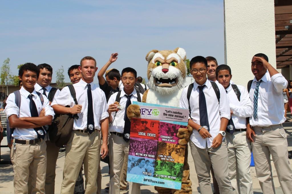 The West Ranch football team pose around West Ranch's Wildcat.