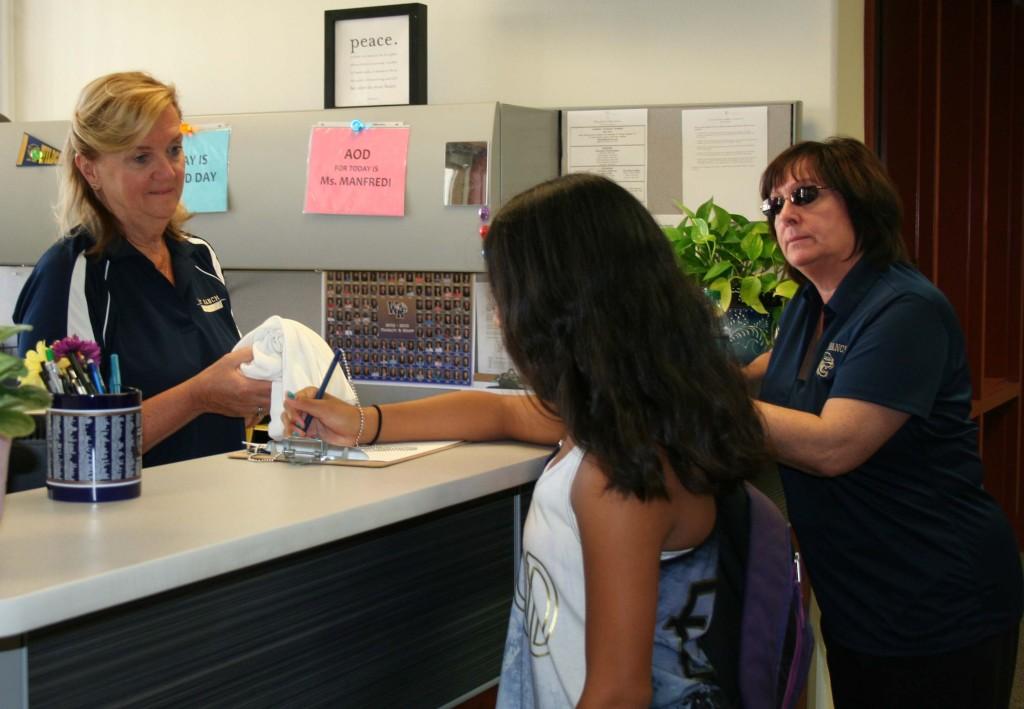 Rose Wagenar hands West Ranch sophomore, Siobhan Rubio, a shirt to demonstrate what happens when you get dress coded.