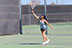 Celine Vartany serves the ball against her opponent. 