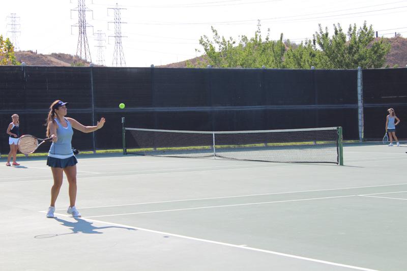 Brianna Almaraz hits a forehand across the court.