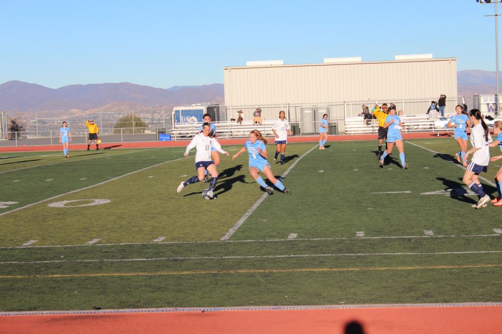 Senior Gianna Crimi attacks the ball against a Crescenta Valley forward