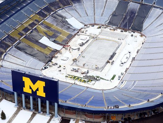 The process of converting a football field to a ice rink at Michigan Stadium.