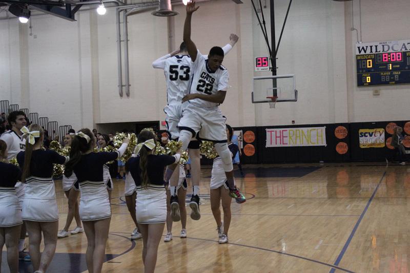 Freshman Milan Taylor and senior Ryne Williams undergo their pre-game preparations.