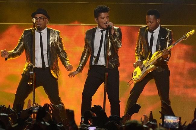 Bruno Mars and his band performing during the halftime show