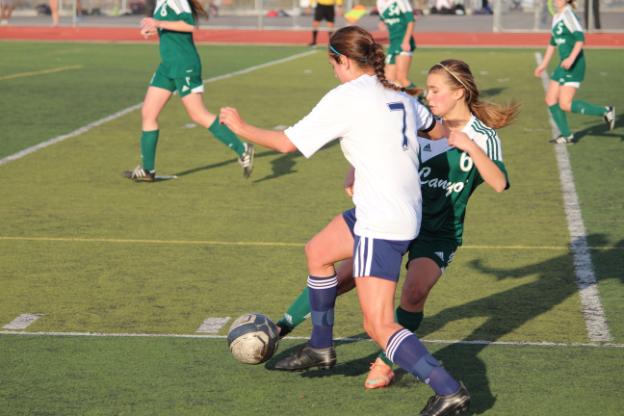 Senior Nicolette Marinello tries to get past a defender in attempt to score a goal.