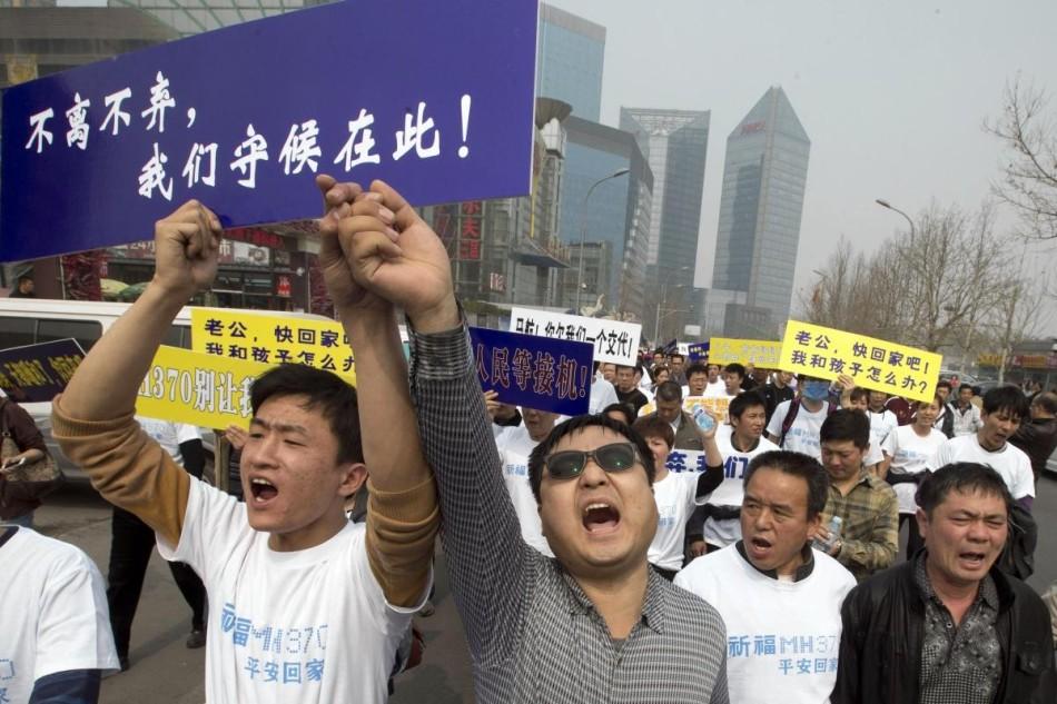 The announcement of the lost of all 239 passengers on the missing Malaysia Airlines flight has sparked protests in Beijing.