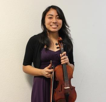 A freshman violinist after just performing in front of the judges.