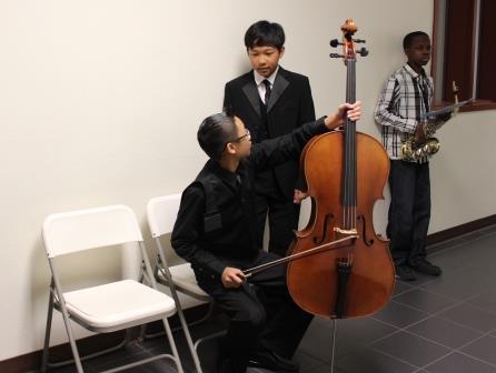 Students from Rancho Pico Junior High School preparing to play in front of a judge.