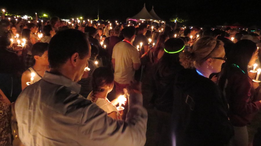 Relay for Life attendees gather at the Luminaria ceremony with candles in hand. 