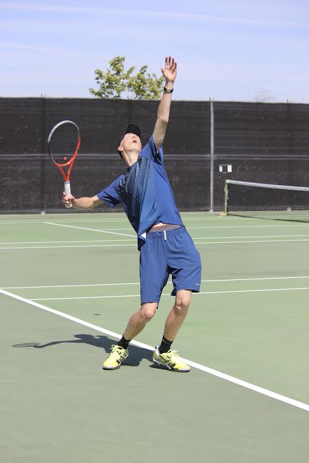 Collins serves the ball in a recent singles match. 