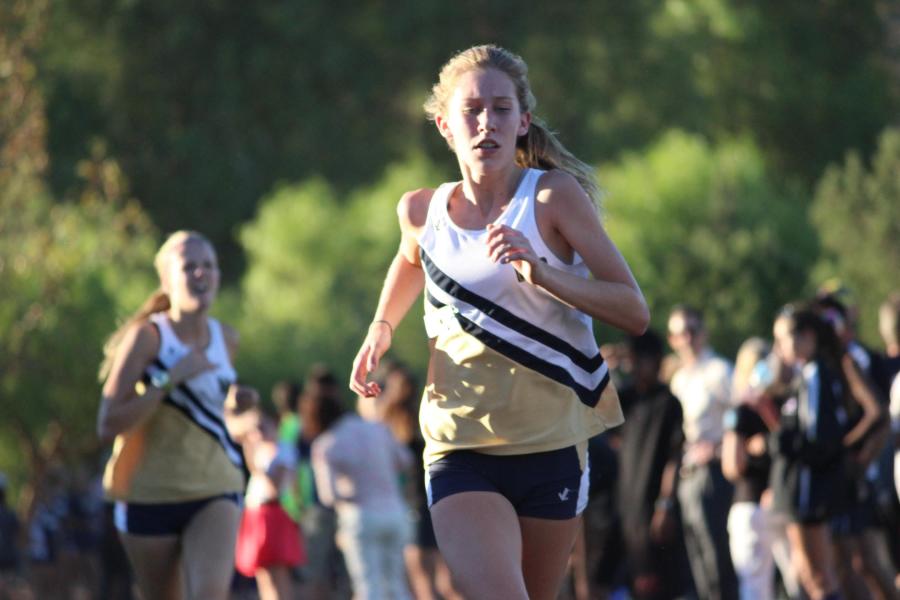Sophomore Avery El-Farra and junior Cailie Binnie run for the finish line. 