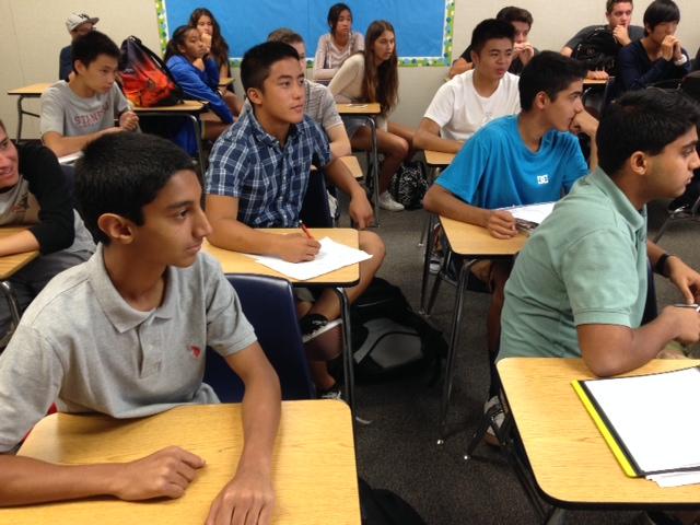 FBLA students take notes during a meeting.
