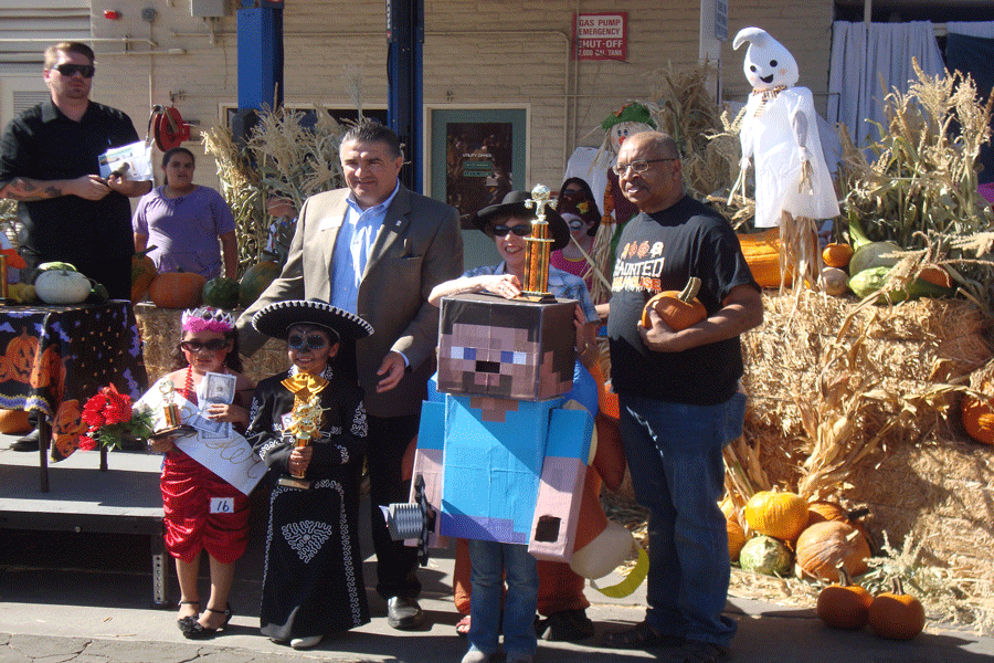 Kids accept their awards for the costume contest.