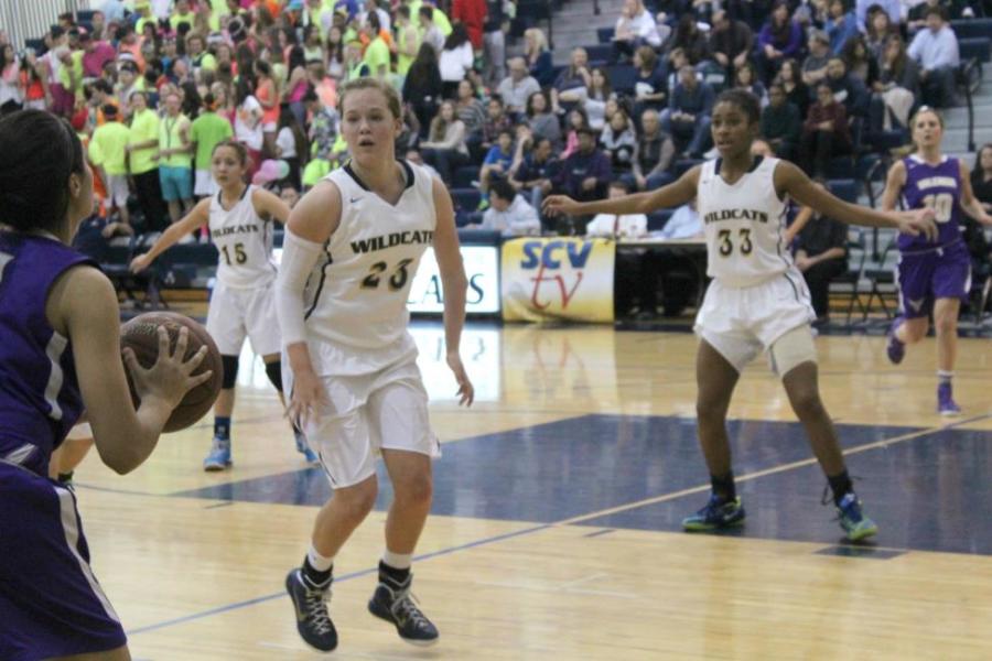 Freshman Annie Christofferson rushes to prevent Valencia from scoring. 