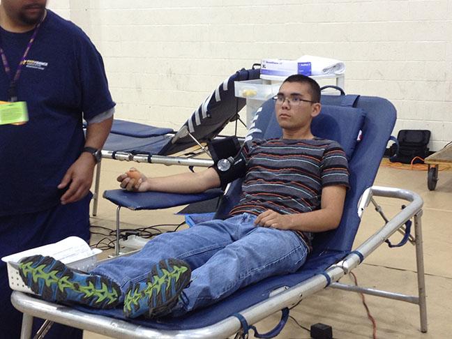 Junior Elias Combs has his blood drawn out. 