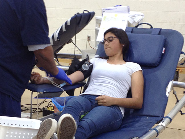 Junior Cristina Sanchez donates her blood. 