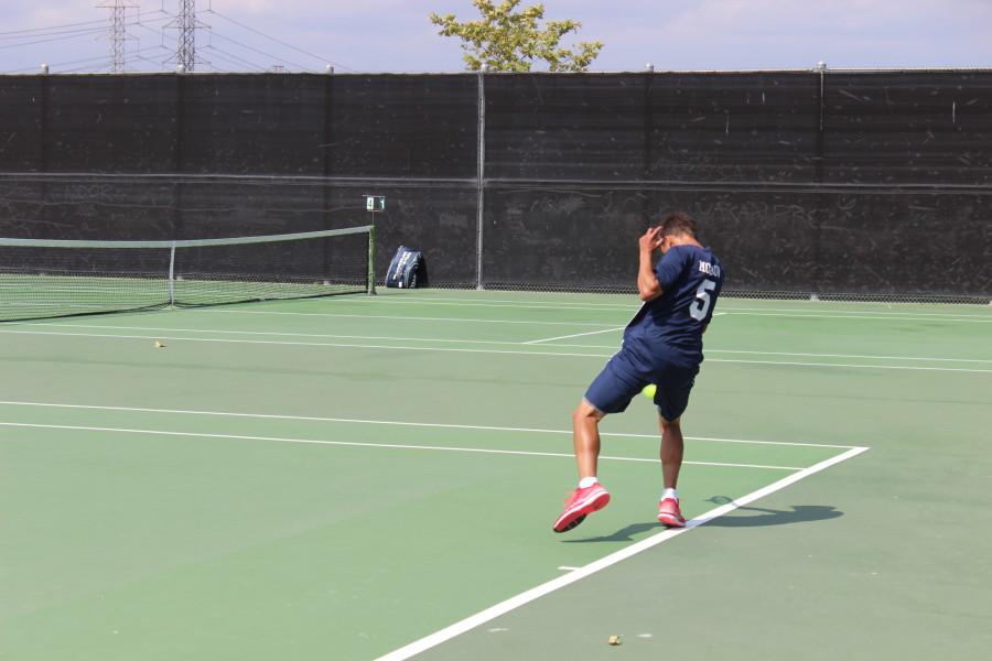 Sophomore Noah Morrow hits a forehand in his 6-1 win.