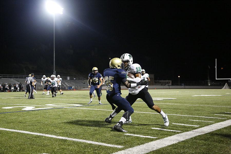 West Ranch's Jordan Hunt tackles the Thousand Oaks running back.