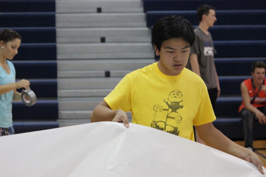 Each and every detail of a rally has to be perfect. ASB member Matthew Ludovico arranges the poster while checking to see if everything is in place.