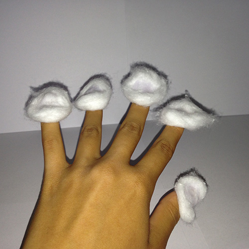 Press the cotton ball on to your nail so that the wet side is facing downwards.