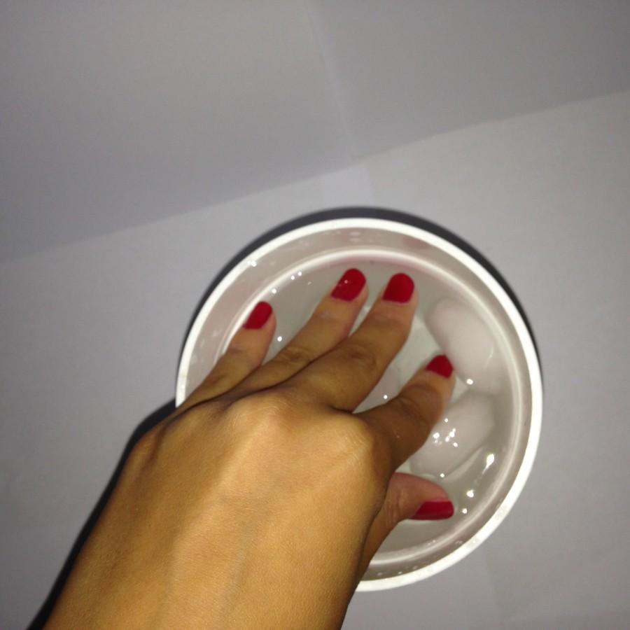 Grab a bowl of cold water and submerge your nails in it for two to three minutes.