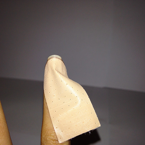 Position the tip of the bandage near the tip of your nail.