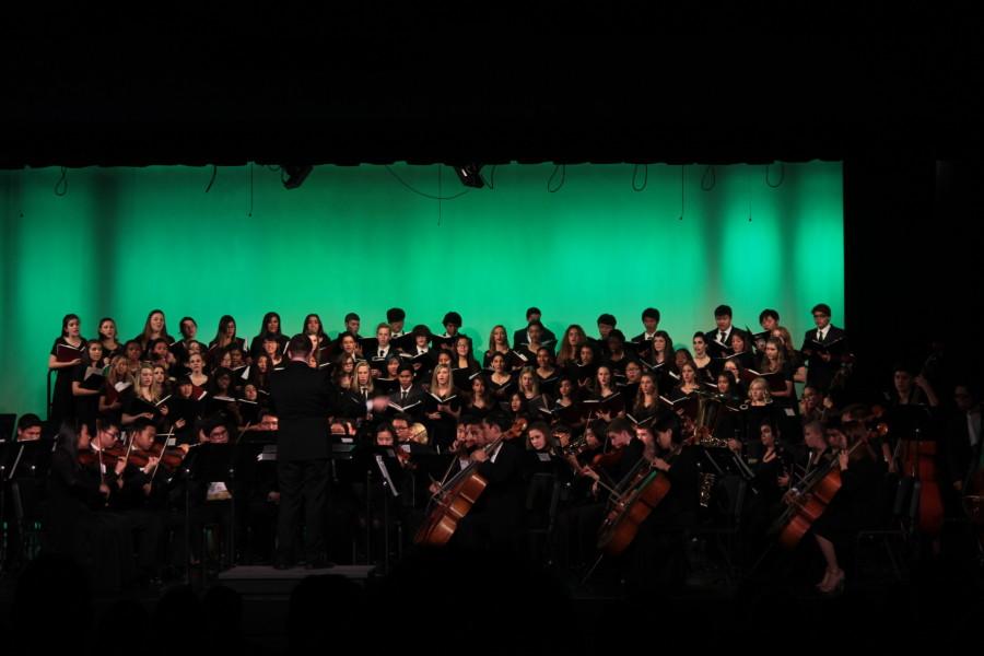 Choir and orchestra deck the halls with sounds of jolly