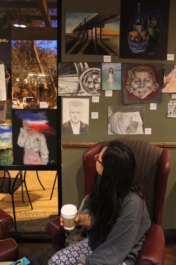 Jaeun Park admires her fellow students art.