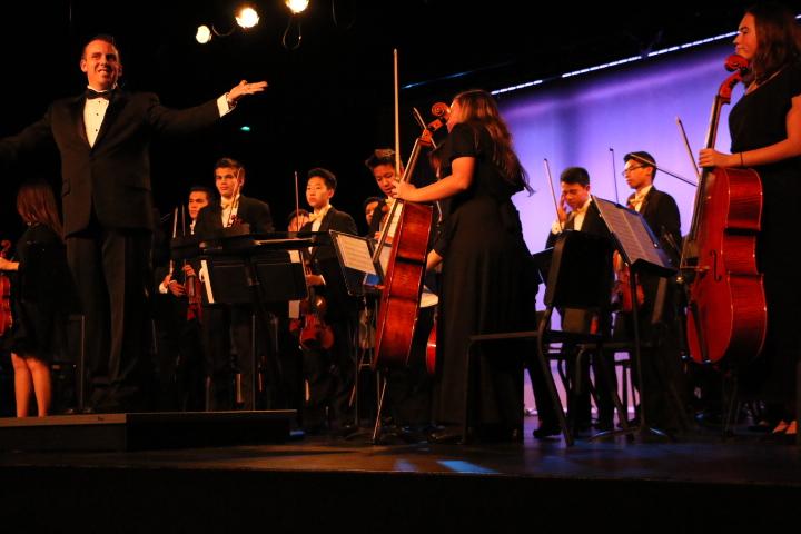 Orchestra takes their bow after they finish their final piece. 