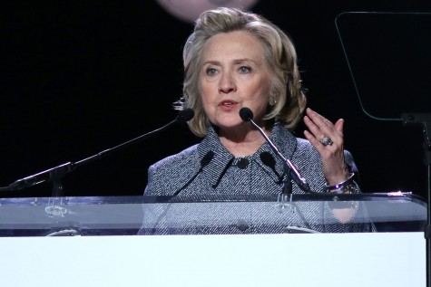 Hillary Clinton is speaking in front of a crowd.