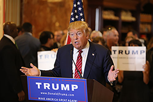 Donald Trump is giving a speech to his supporters during his presidential race.