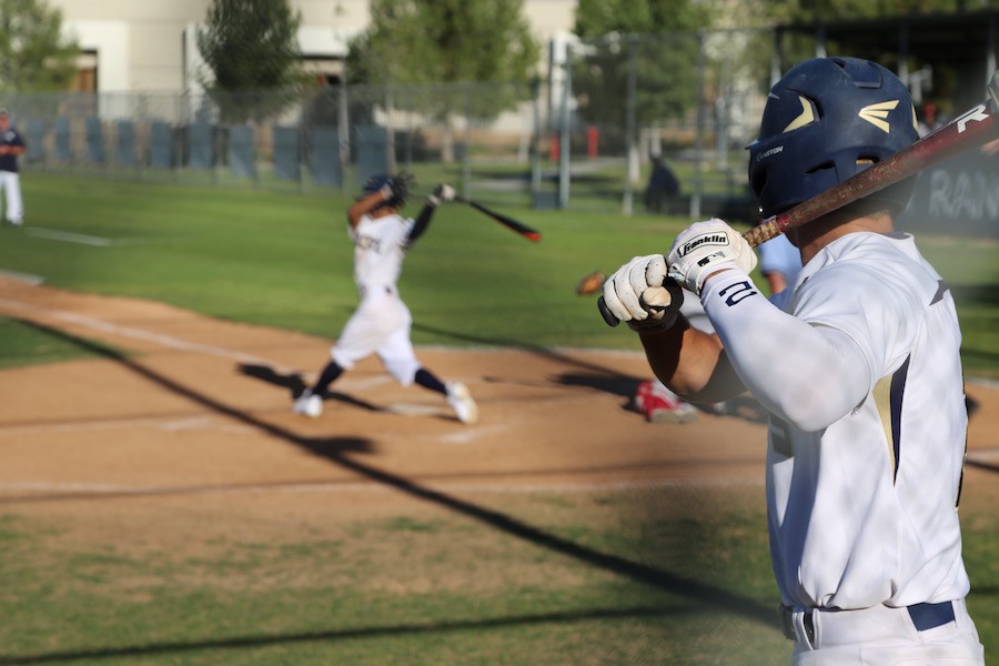 A swing and a miss: the Cats struggled to get hits all game long against Burroughs on March 1.