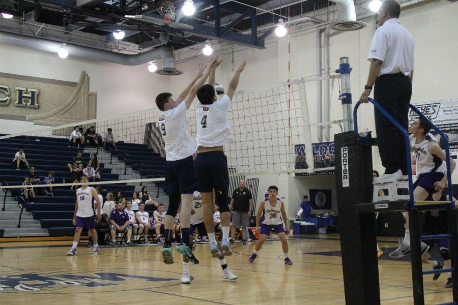 Senior Nicholas Christy and junior Derek Seo put up a solid block against Valencias outside attacker