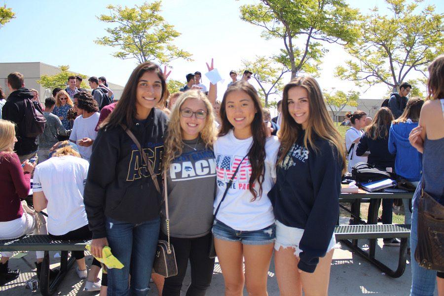 Seniors Kelsey Fernando, Tali Brian, Claudia Lee, and Brianna Reardon show off their spirit wear.