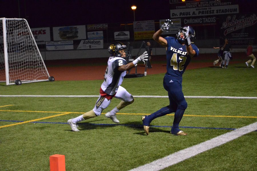 Camacho attempts to haul in a TD pass from Eget.