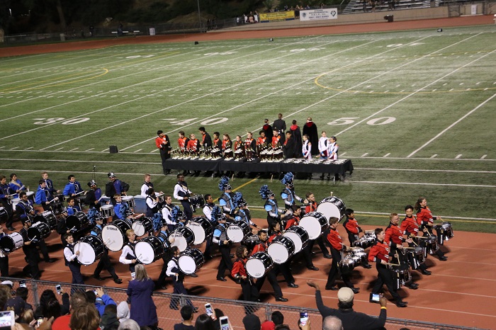 After all the marching bands perform, drumlines from the participating schools come together to play a beat together before the awards ceremony starts.