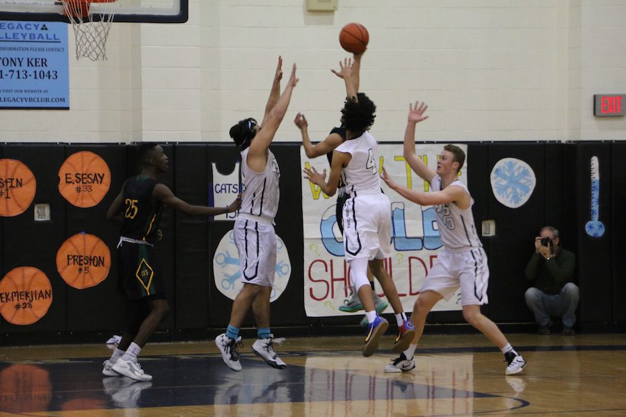 Seniors Ben Birchall, Suren Aghazadian, and sophomore Andrew Austin with the defensive plays. 