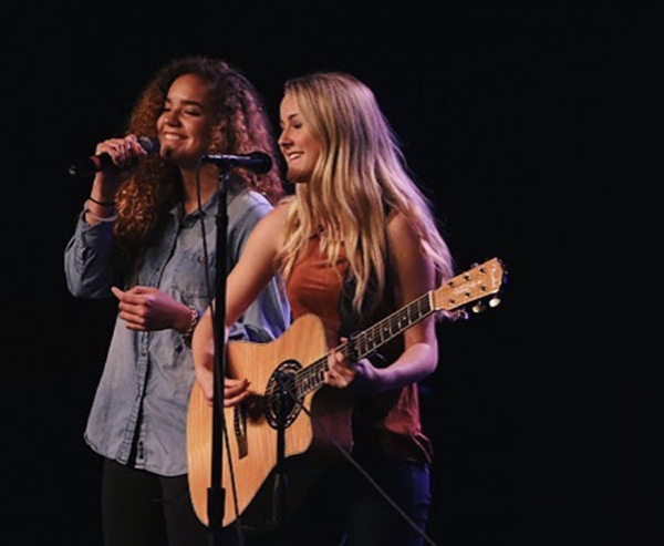 Marley (on left) singing for open mic