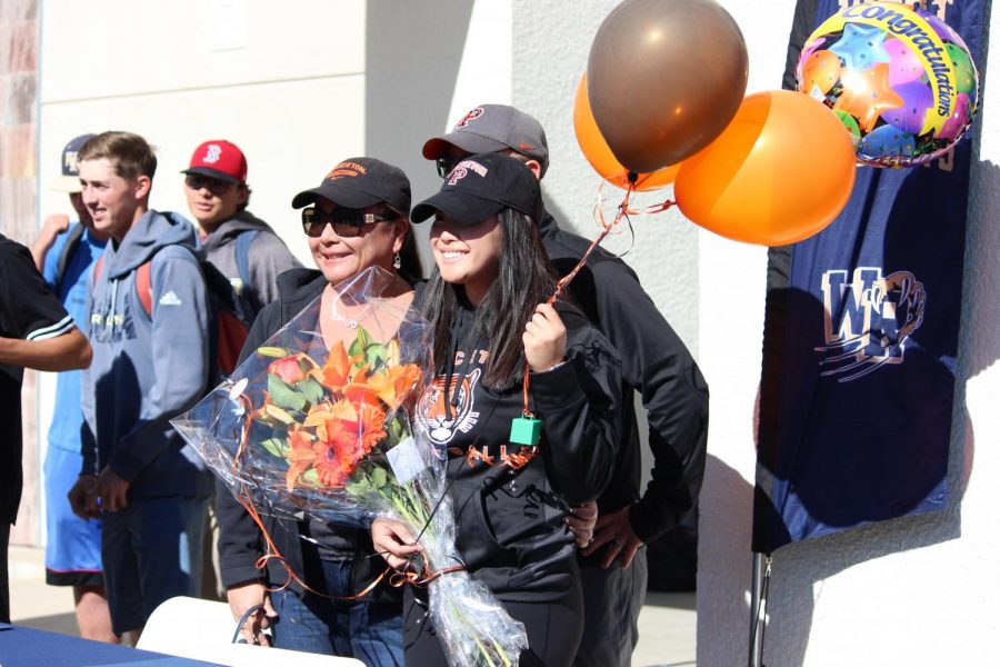 Adrienne Chang stands with family. 