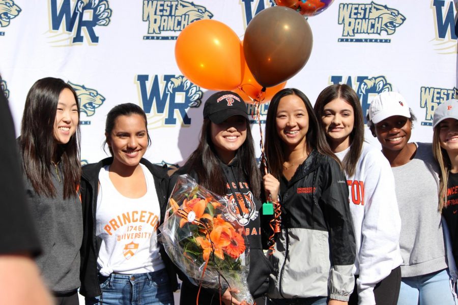 Adrienne Chang stands with teammates after signing her letter of intent. 
