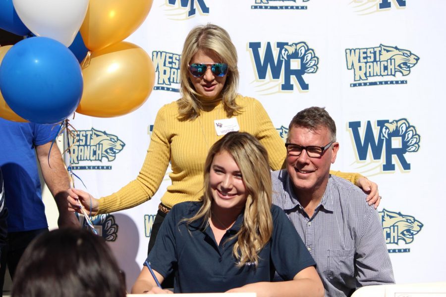 Sophie Bobal stands with her family after signing her letter of intent. 