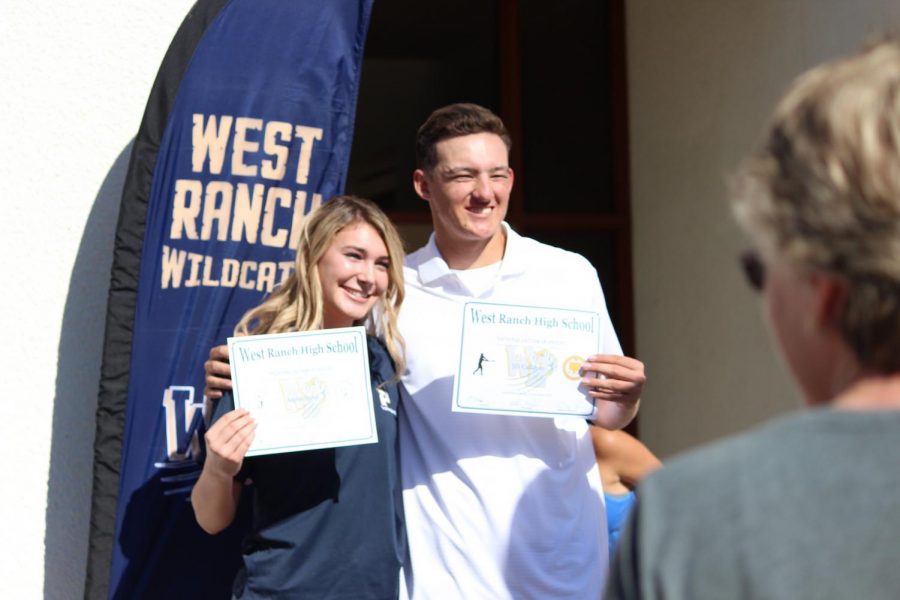 JD Callahan and Sophie Bobal stand together. 