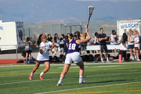 Varsity Girls Lacrosse Team Crushes Vikings in First League Game